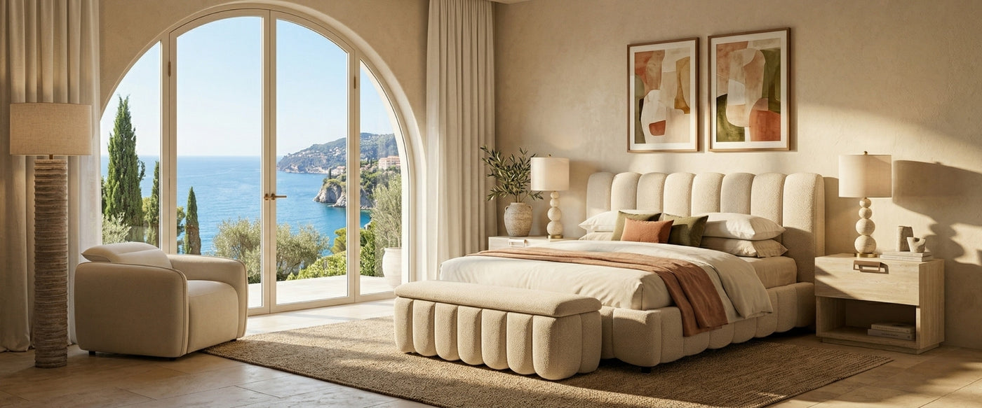 French Riviera modern bedroom by OROA with an upholstered bed, accent chair, matching nightstands, and curated decor framed by ocean views. | Oroa.com