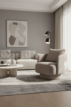   Modern living room with a beige sofa, armchair, and abstract art on the wall. | Oroa.com